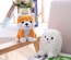 Muñeco parlante eléctrico de Pomerania y Shiba Inu