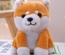 Muñeco parlante eléctrico de Pomerania y Shiba Inu